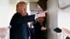 Presiden Amerika Serikat Donald Trump memberikan keterangan kepada reporter di pesawat Kepresidenan AS, Air Force One, 5 April 2018. (Foto: dok)