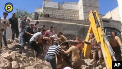 FILE - Civil defense workers and Syrian citizens inspect damage to buildings after airstrikes hit a market area in Idlib, Syria, June. 12, 2016.