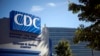 FILE - A sign marks the entrance to the Centers for Disease Control and Prevention, in Atlanta, Georgia, Oct. 8, 2013.