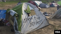 FILE - Many of the tens of thousands of refugees in Idomeni, Greece, have been camping by the border for more than a month, and still hope to pass through Macedonia into Western Europe, March 30, 2016. (Photo - H. Murdock/VOA)