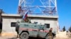 Russian forces armored vehicles patrol the Syrian border in Kobani, Oct. 23, 2019.