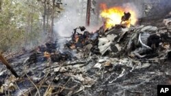 This photo released by Costa Rica's Civil Aviation press office shows the site of a plane crash in Punta Islita, Guanacaste, Costa Rica, Sunday, Dec. 31, 2017. 