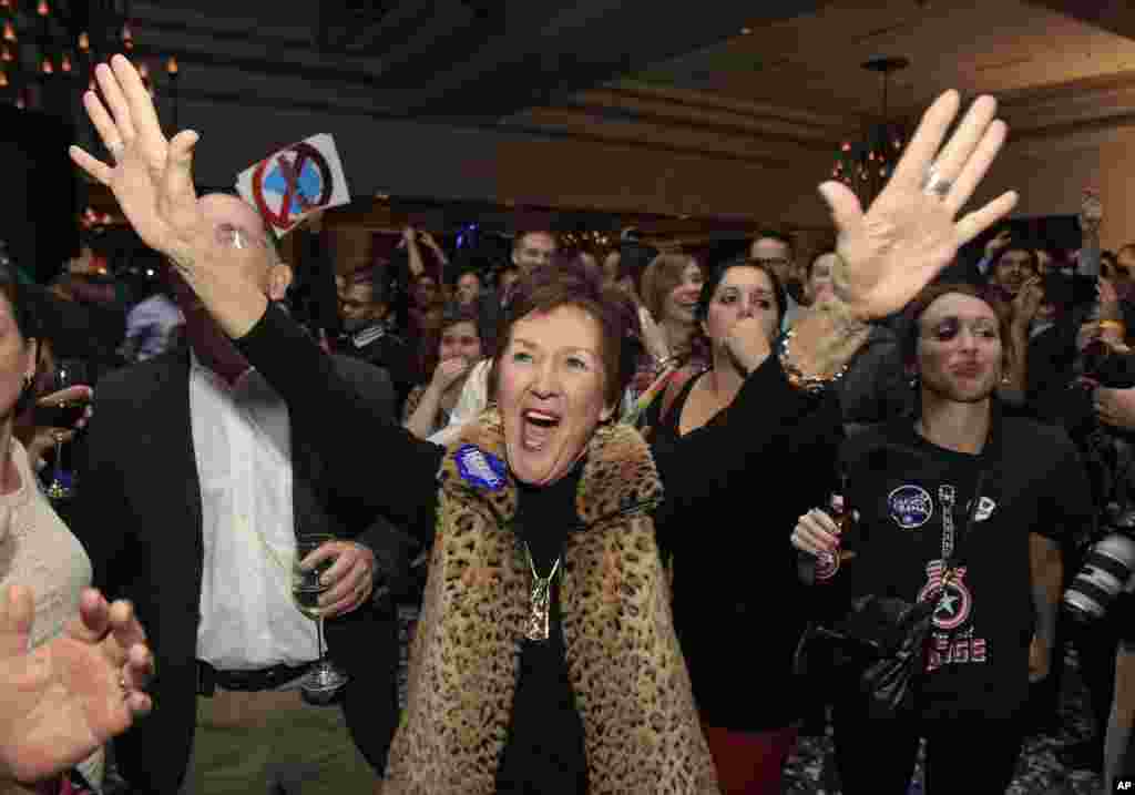 Democrats celebrate reports that President Barack Obama won the election at the Ohio Democratic party election night celebration early Wednesday, Nov. 7, 2012, in Columbus, Ohio. 