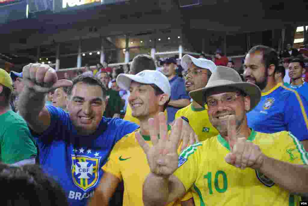 What was the final margin of Brazil's victory? The fan in the no. 10 jersey has the answer. VOA/M/ Lipin
