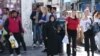 People walk on busy Munich street in Germany, Sept. 17, 2015. (Photo: L. Ramirez / VOA) 