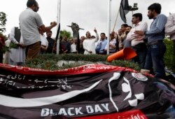 FILE - Pakistani journalists take part in a demonstration to denounce rampant censorship, in Islamabad, Pakistan, July 16, 2019.