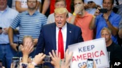 President Donald Trump arrives at a campaign rally at U.S. Bank Arena, Aug. 1, 2019, in Cincinnati. 