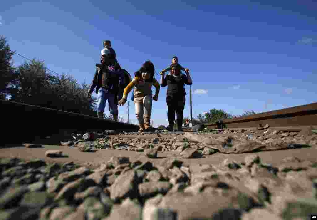 Some migrants cross the border line between Serbia and Hungary near Roszke.