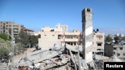 A view shows the remains of a building after it was destroyed in Israeli air strikes, amid a flare-up of Israeli-Palestinian fighting, in Gaza City May 18, 2021.