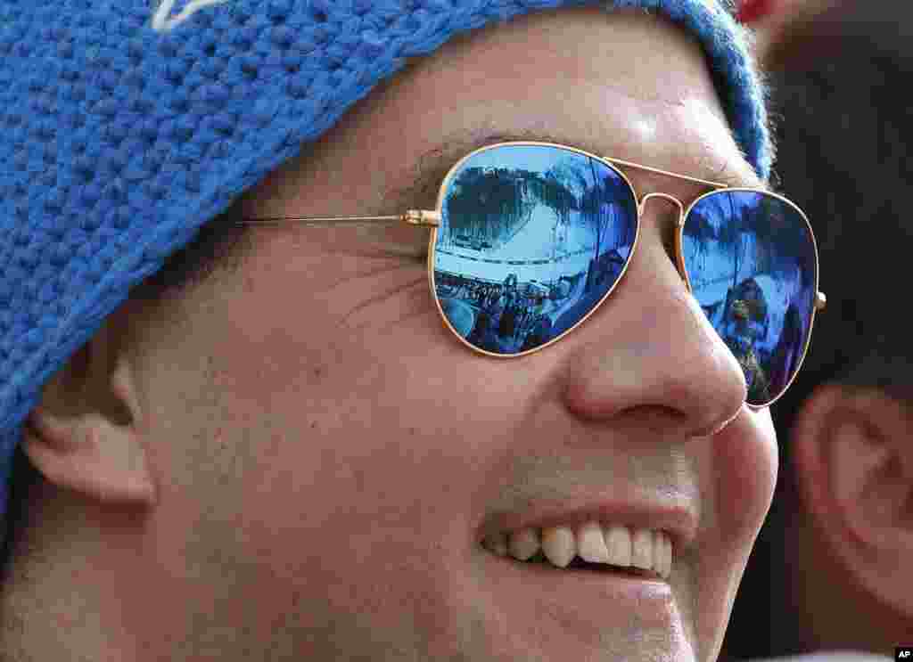 Russian Prime Minister Dmitry Medvedev watches the skiing competition during the 2014 Winter Olympics, Sochi, Russia, Feb. 9. 2014.