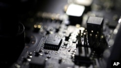 FILE - This Feb 23, 2019, photo shows the inside of a computer in Jersey City, NJ.