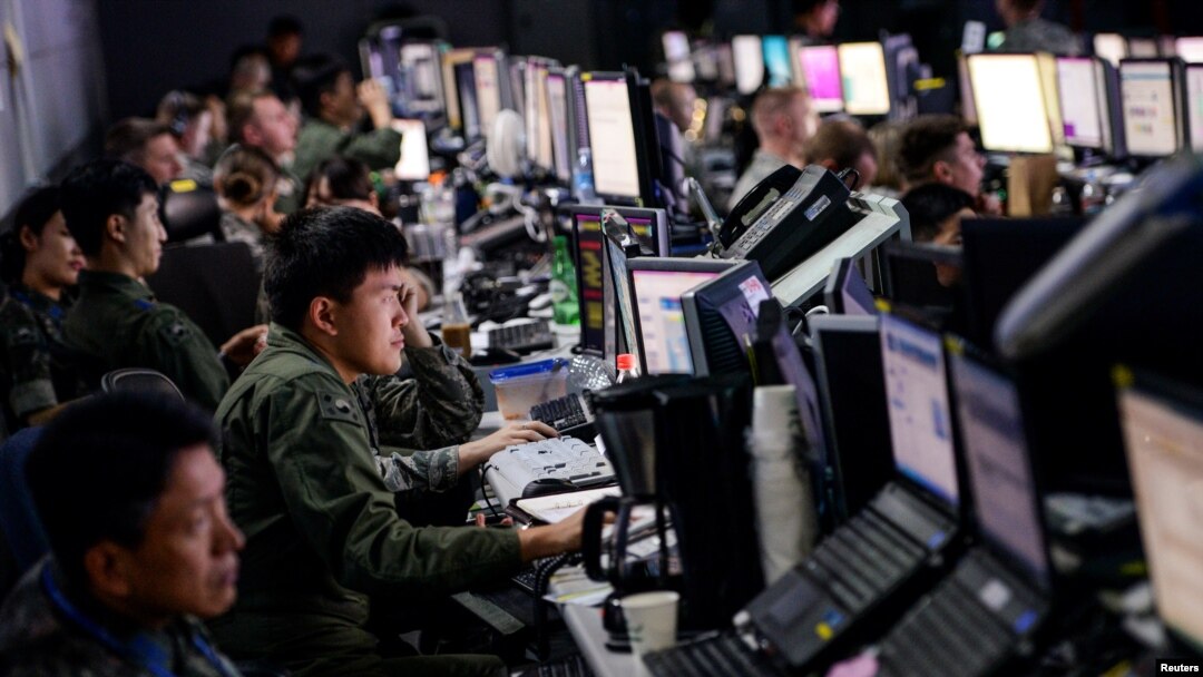 FILE - Members from U.S. and South Korean militaries man the Hardened Theater Air Control Center during the first day of Ulchi Freedom Guardian at Osan Air Base, South Korea, Aug. 17, 2015