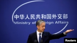 FILE - Chinese Foreign Ministry spokesman Wang Wenbin addresses reporters in Beijing, Dec.14, 2020. The ministry recently revealed sanctions against Mercator Institute for China Studies in Germany, Alliance of Democracies Foundation in Denmark and others.