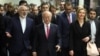 Iranian Foreign Minister Mohammad Javad Zarif, left, Director General of the International Atomic Energy Agency, IAEA, Yukiya Amano of Japan and European Union High Representative Federica Mogherini, right, arrive at the International Atomic Energy Agency