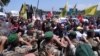Hezbollah supporters scuffle with Lebanese army soldiers while protesting the visit by Gen. Frank McKenzie, the head of U.S. Central Command, outside ​​the Rafik Hariri International Airport in Beirut, Lebanon, July 8, 2020.