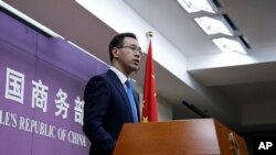 FILE - Chinese Ministry of Commerce spokesman Gao Feng speaks during a press conference at the ministry, in Beijing, China, April 6, 2018.