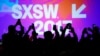 Audience members use their mobile phones to take photographs of former U.S. Vice-President Joe Biden at the South by Southwest (SXSW) Music Film Interactive Festival 2017 in Austin, Texas, March 12, 2017.