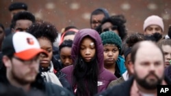 Students gather on their soccer field during a 17-minute walkout protest at the Stivers School for the Arts in Dayton, Ohio, March 14, 2018.