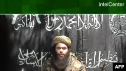 FILE - This handout photo provided by IntelCenter shows a video frame of Abdelmalek Droukdel, al-Qaida's North Africa chief, broadcast by Al Jazeera on May 8, 2007. France said that its troops and allied forces killed Droukdel on June 3, 2020, in Mali.